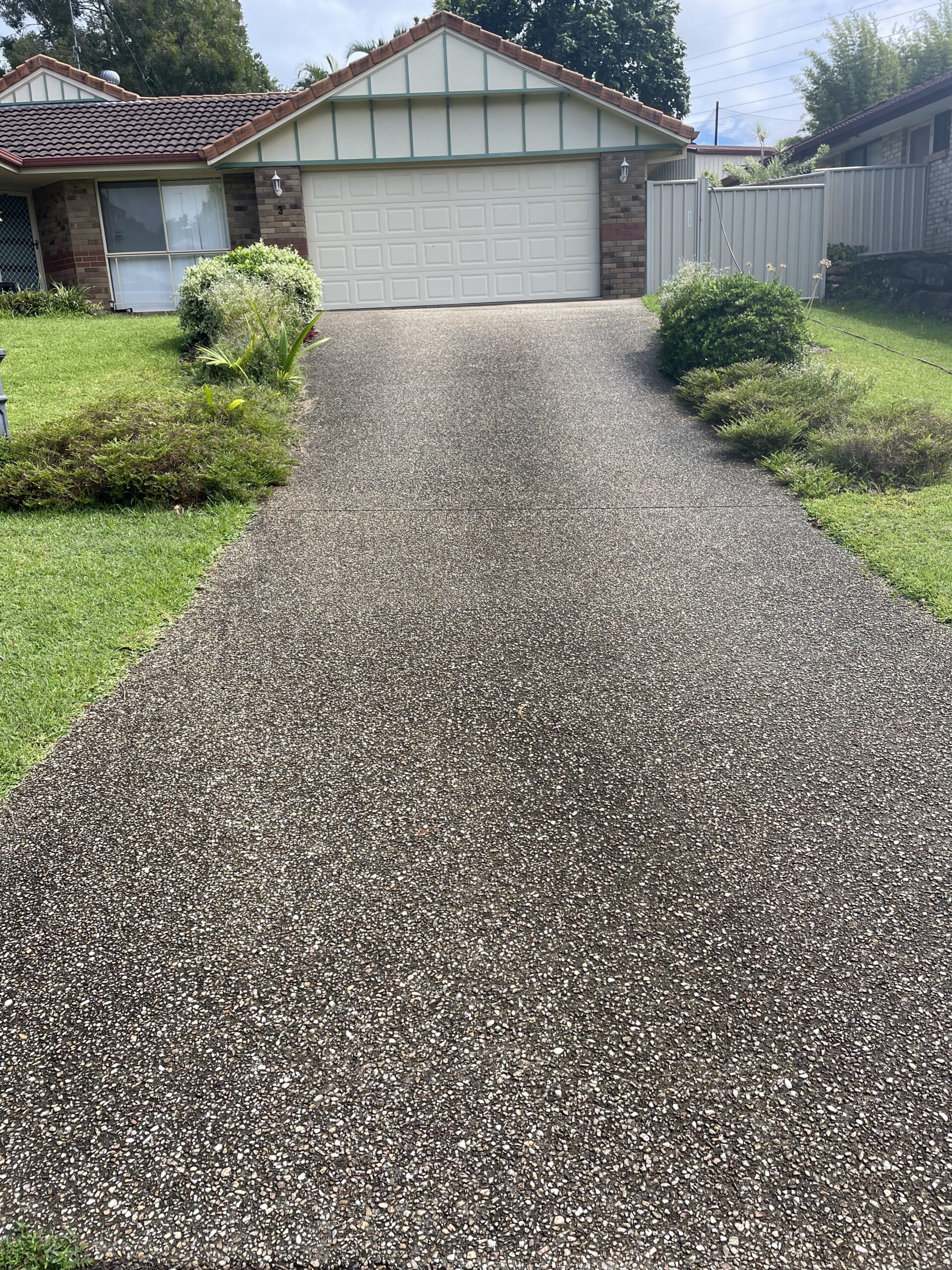 Before pressure cleaning: Driveway concrete cleaning service on the Gold Coast