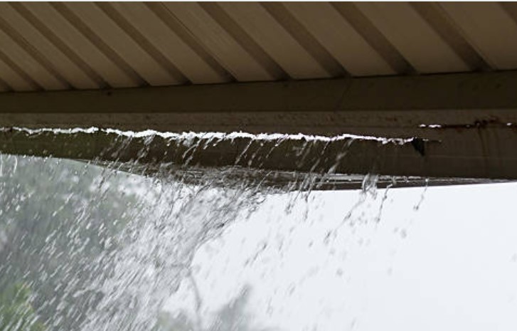 Professional gutter cleaning service in action, Gold Coast