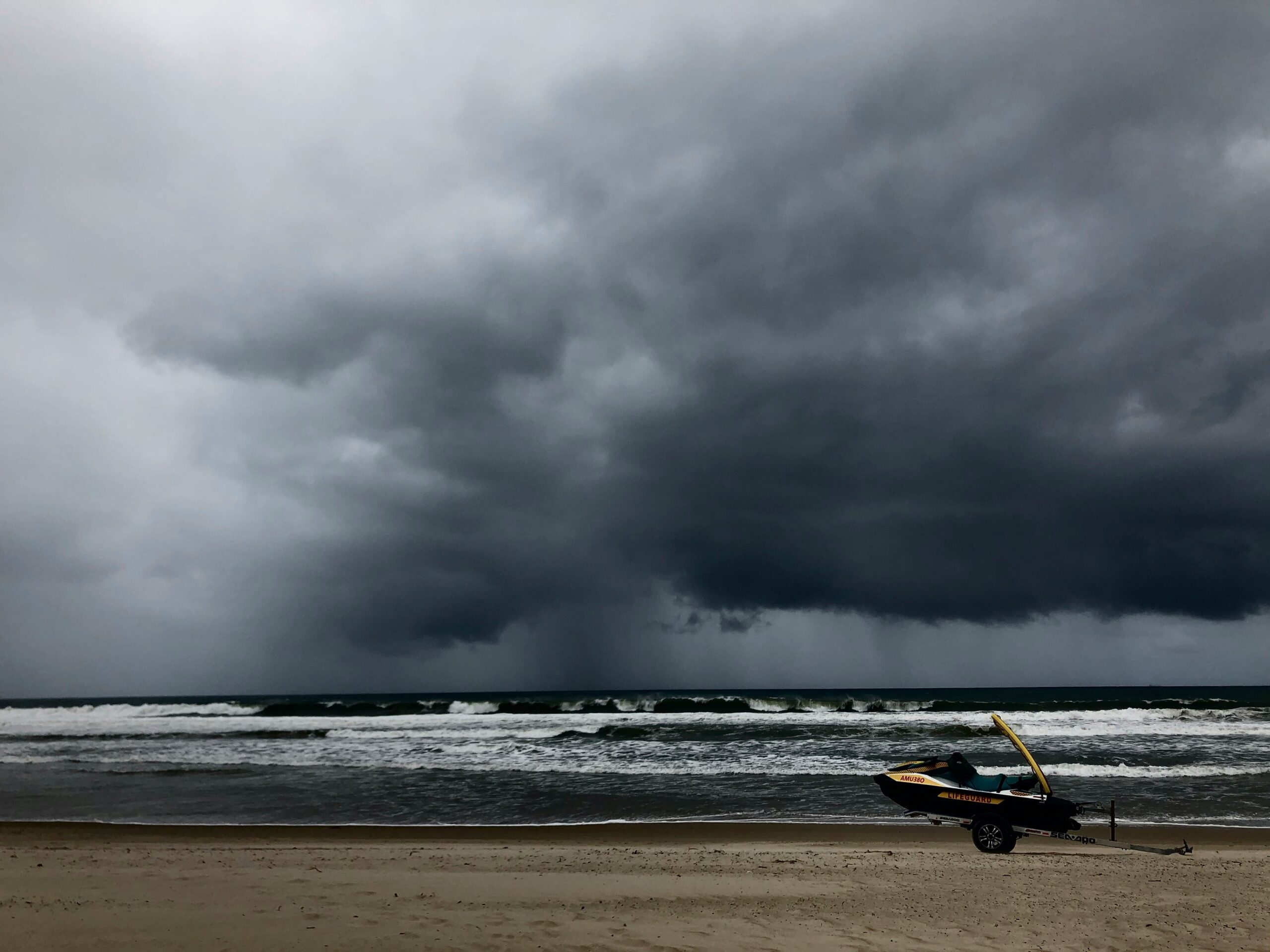 Professional gutter cleaning during storm, Gold Coast